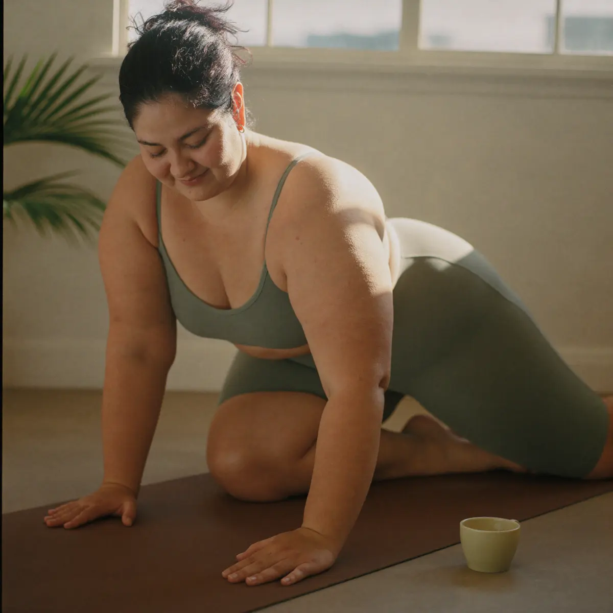 Woman stretching on a yoga mat
