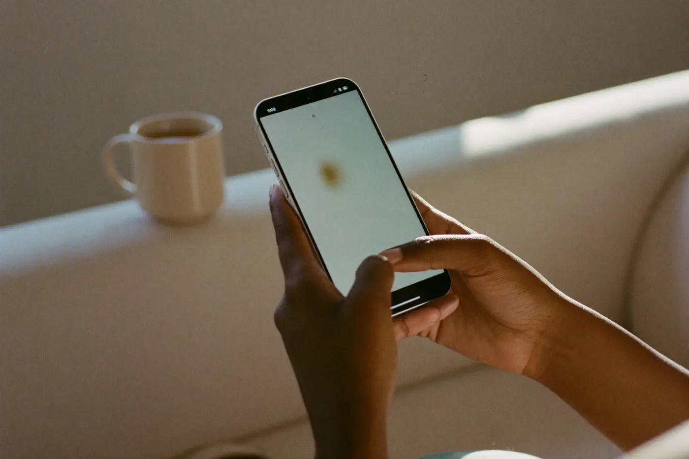 Hands completing the intake on a phone at home